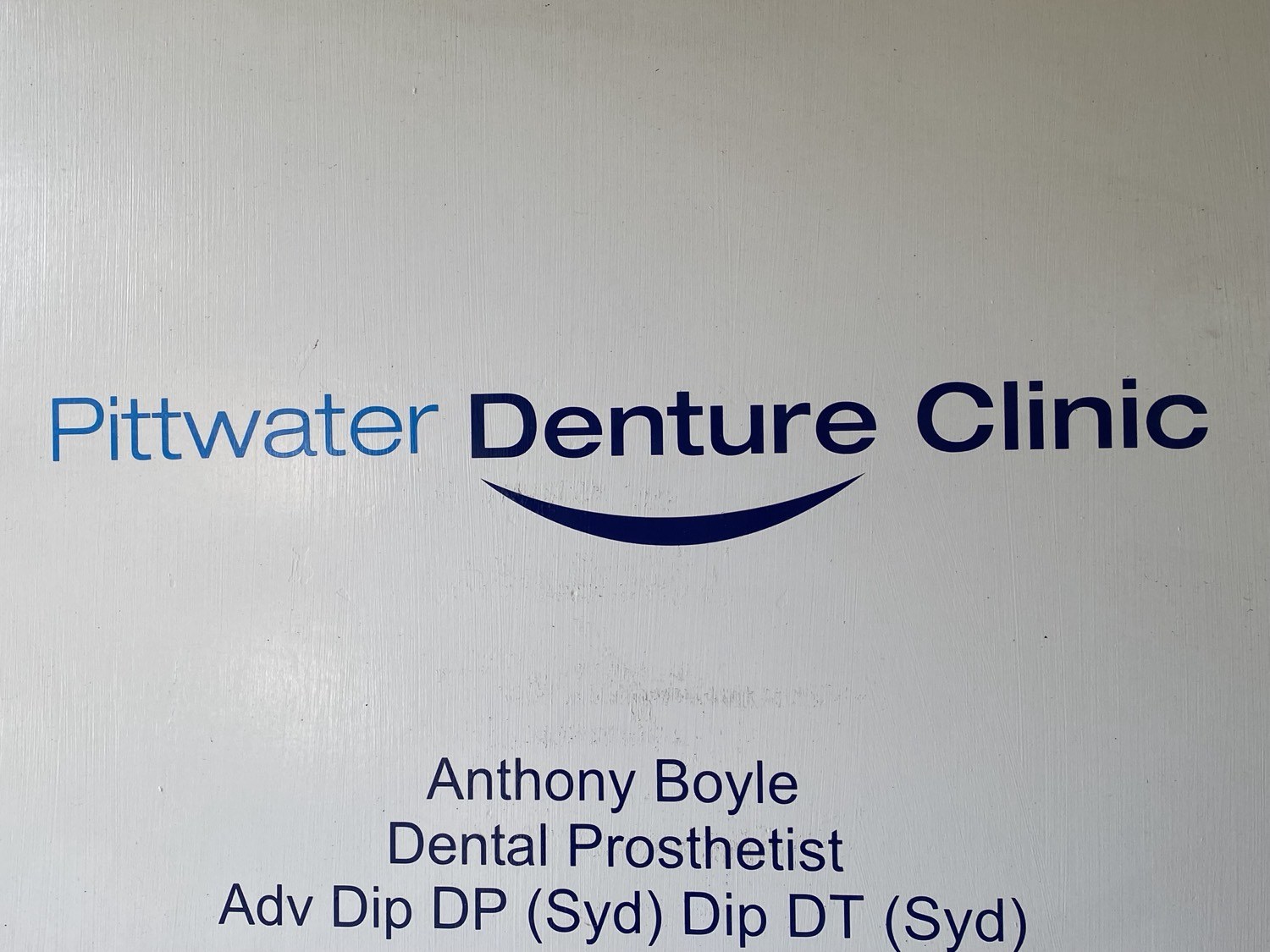 Clinic wall sign: Anthony Boyle, Dental Prosthetist, Adv Dip DP (Syd) Dip DT (Syd).